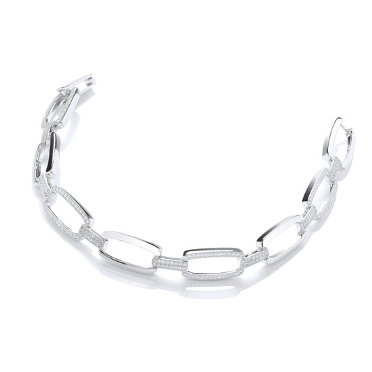 Silver bracelet with interlocking links on a white background