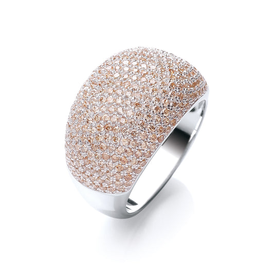 Silver ring with rose gold and clear gemstones on a white background