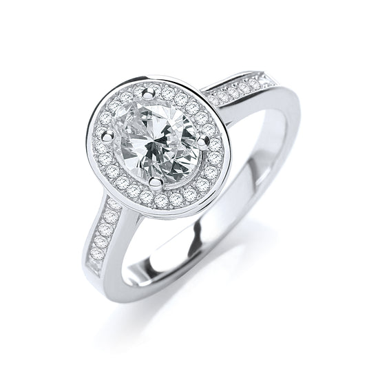 Silver ring with a large central gemstone and smaller stones around on a white background