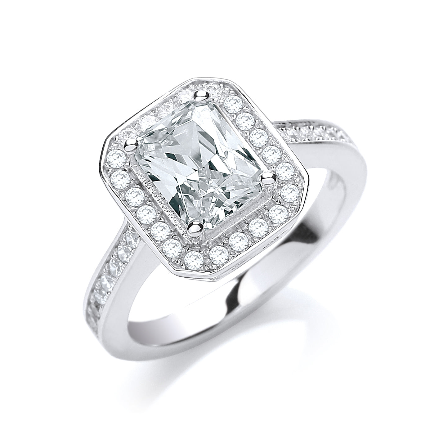 Silver ring with a large central diamond and smaller diamonds around on a white background