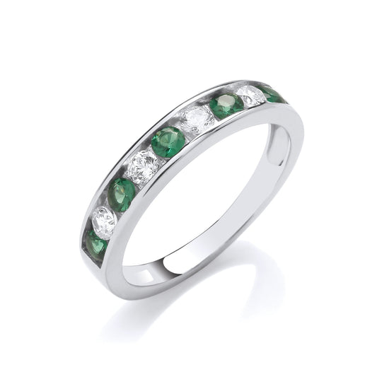 Silver ring with green gemstones on a white background
