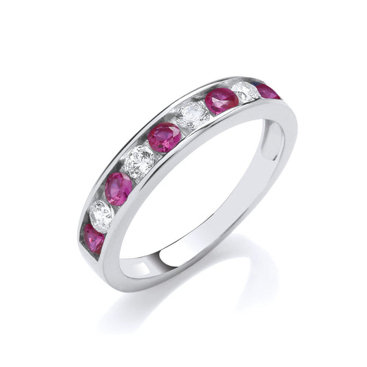 Silver ring with pink gemstones on a white background