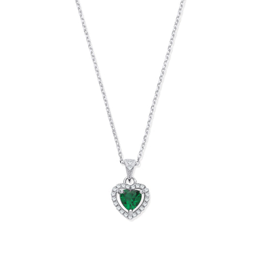 Heart-shaped emerald pendant on a chain against a white background