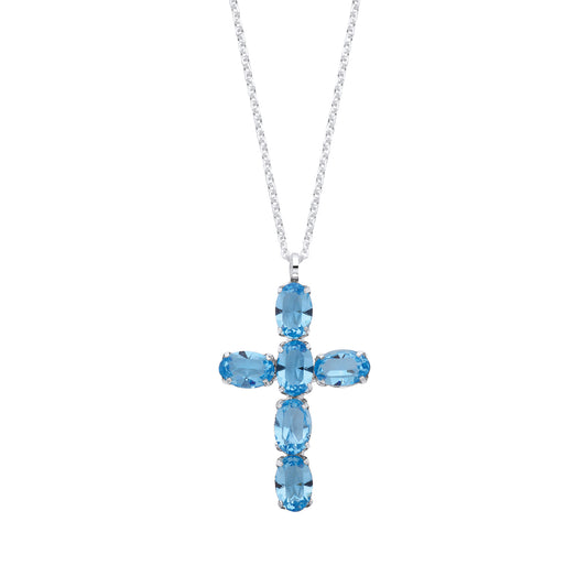 Cross-shaped pendant with blue gemstones on a white background