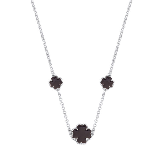 Necklace with three black flower-shaped pendants on a white background