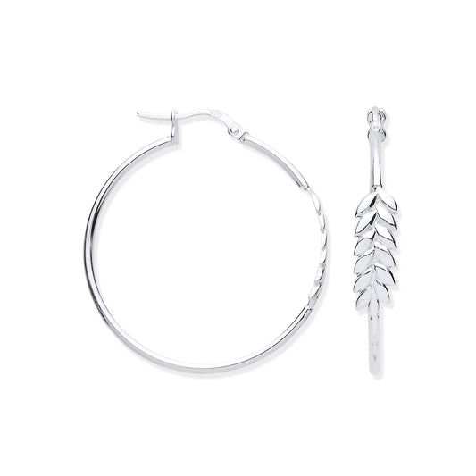 Silver hoop earring with leaf-shaped pendant on a white background