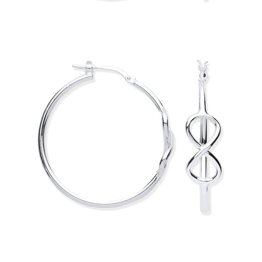 Silver hoop earrings and a silver infinity symbol pendant on a white background