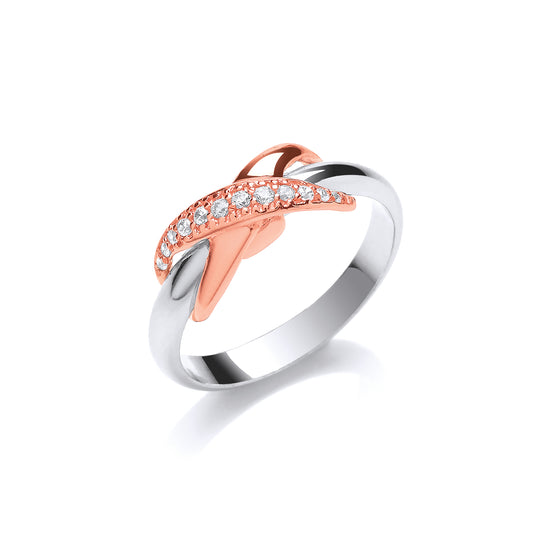 Two-tone ring with rose gold and silver design on a white background